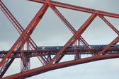 a telephoto zoom image of the train on the forth bridge